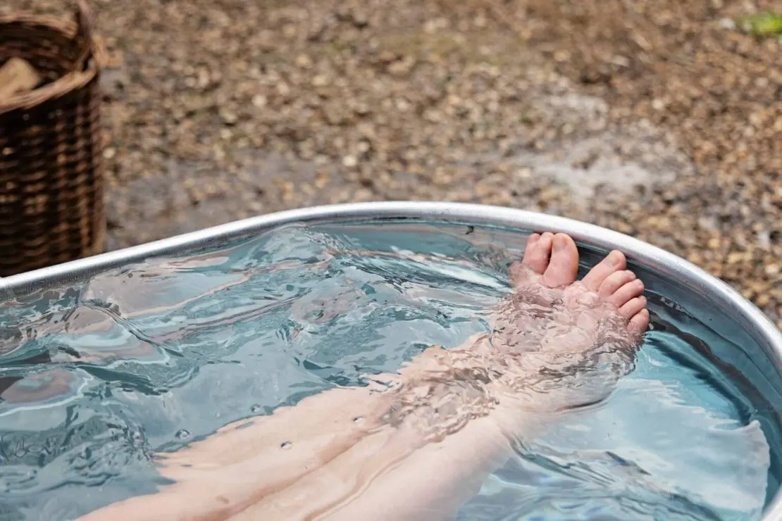 Legs in the cold plunge tub